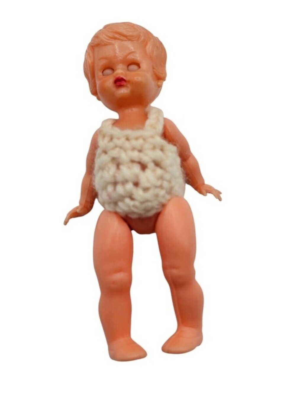 vintage Redbox hard plastic baby doll, likely from the 1950s to early 1980s